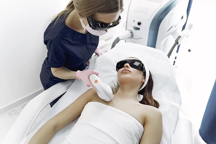 Laser hair removal on a patient's face