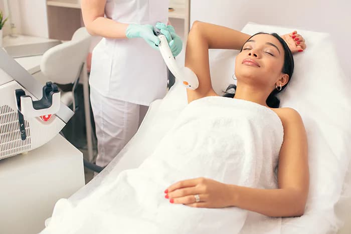 Laser hair removal being performed on the underarm
